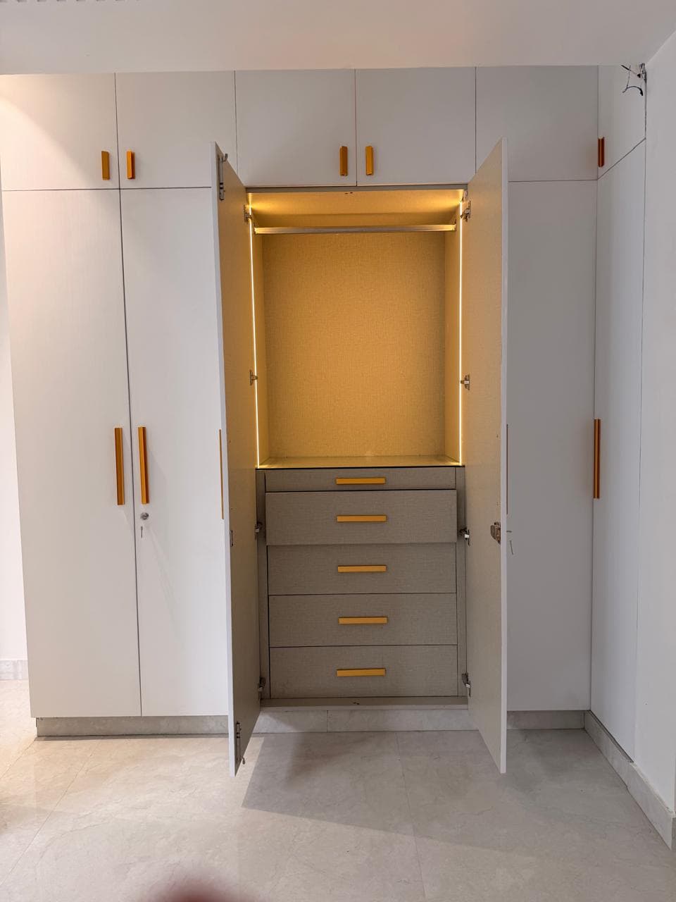 Hinged wardrobe with drawer stack - Misri Kitchen & Home Interior